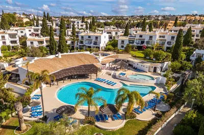 an aerial view of a resort with a swimming pool at Apartamento Sol & Mar by Portucasa in Albufeira