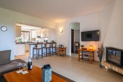 a living room with a couch and a table at Apartamento Sol & Mar by Portucasa in Albufeira