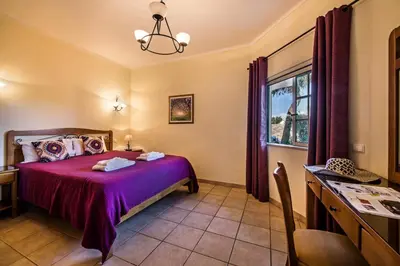 a bedroom with a bed and a window at Rebela GF by Algarve Villa Holidays in Albufeira