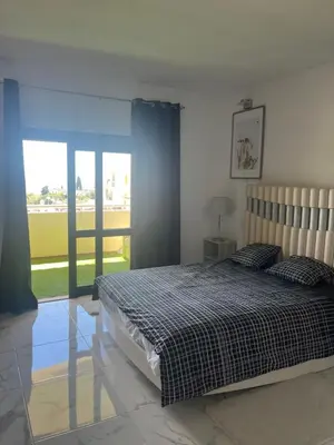 a bedroom with a bed and a large window at Amazing Sea View Studio w Pool in Albufeira