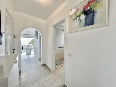 a living room with a couch and a fireplace at Albufeira Tropical View 2 by Homing in Sesmarias