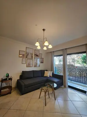 a living room with a couch and a window at Brisa do Atlântico 201 in Albufeira