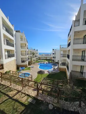 an apartment complex with a swimming pool in a courtyard at Brisa do Atlântico 201 in Albufeira
