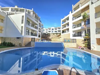 a swimming pool in front of a apartment building at Brisa do Atlântico 201 in Albufeira