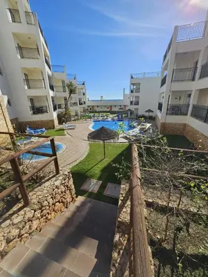 an apartment complex with a swimming pool and buildings at Brisa do Atlântico 201 in Albufeira
