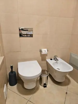 a bathroom with a toilet and a sink at Brisa do Atlântico 201 in Albufeira