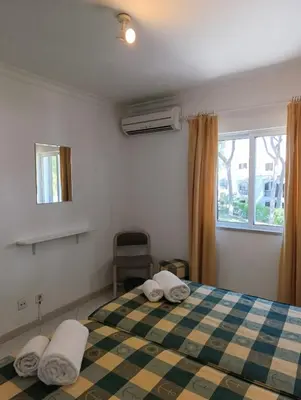 a bedroom with a bed with two pillows on it at Balaia Golf Village 122 in Albufeira