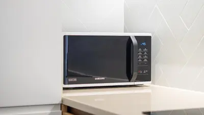 a microwave oven sitting on top of a counter at Modern Studio with Balcony in Salgados by Lovelystay in Guia