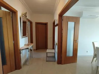 a room with a hallway with a mirror and a door at São rafael Ocean View in Albufeira