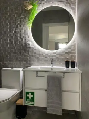 a bathroom with a sink and a mirror at Açoteias Falésia Studio Apartment in Olhos de Água