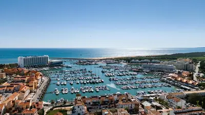 an aerial view of a harbor with boats in the water at Stork nest in Vilamoura