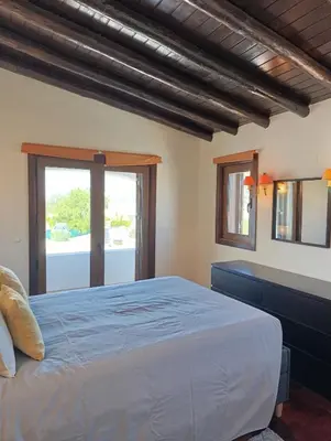 a bedroom with a large bed and a window at Villa Inês in Guia