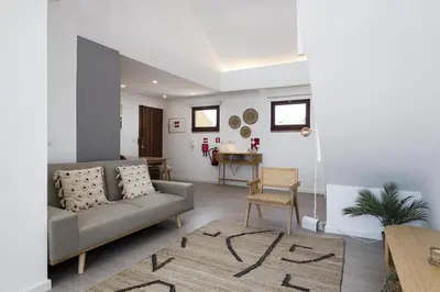 a living room with a couch and a table at Marina Club II - Marina view by HD in Vilamoura
