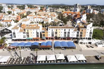 an aerial view of a city with buildings at Marina Club II - Marina view by HD in Vilamoura