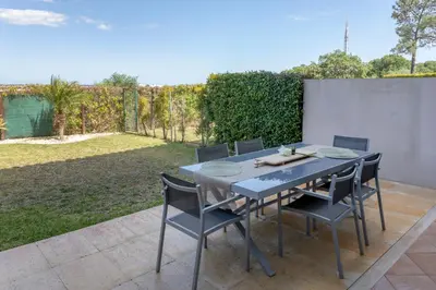 a blue table and chairs on a patio at Moradia Flaj in Olhos de Água