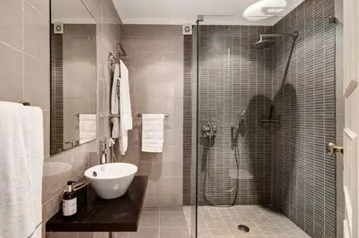 a bathroom with a shower and a toilet and a sink at Apartamento Tennis View in Almancil