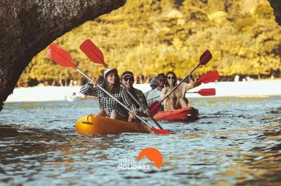 a group of people in kayaks on the water at #312 Ocean Outlook by Home Holidays in Páteo