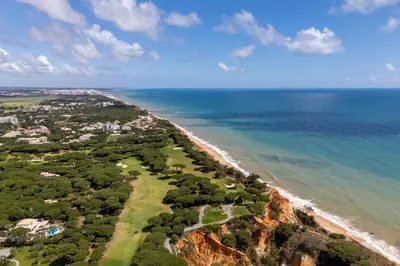 an aerial view of a beach and the ocean at Apartamento Pine by Algarve Holidays in Roja- Pé