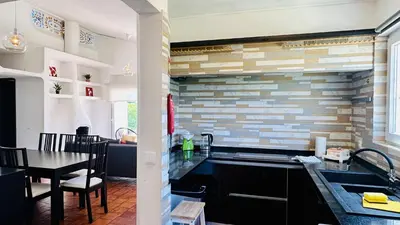 a kitchen with a sink and a dining room at Strip II by Check-in Portugal in Albufeira