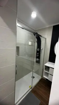 a shower with a glass door in a small bathroom at Albufeira Oura Apartment II in Albufeira