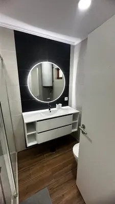 a bathroom with a sink and a mirror at Albufeira Oura Apartment II in Albufeira