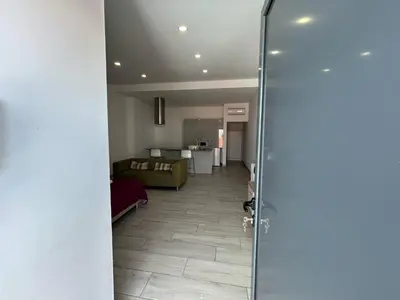 a view of a hallway with a living room at Casa Madalena in Faro