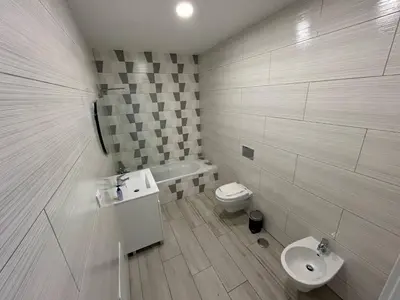 a bathroom with a sink and a toilet at Casa Jonhy in Faro