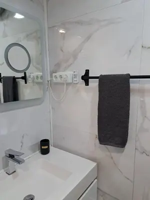 a white bathroom with a sink and a mirror at SMILE Apartment Albufeira in Albufeira