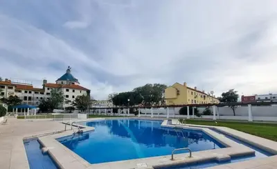 a swimming pool in the middle of a building at Porto Marina Vilamoura LG Studio in Quarteira
