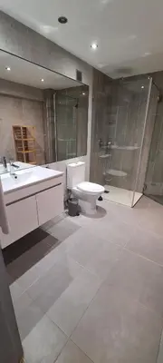 a bathroom with a toilet and a sink and a shower at Porto Marina Vilamoura LG Studio in Quarteira