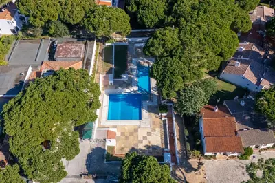 an aerial view of a house with a swimming pool at Charming Yellow Studio in Albufeira in Olhos de Água