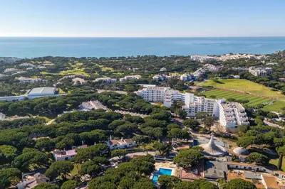 an aerial view of a resort near the ocean at Charming Yellow Studio in Albufeira in Olhos de Água