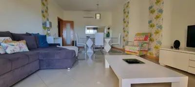 a bathroom with a toilet and a sink and a tub at Encosta Da Orada Vista Mar in Albufeira