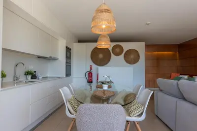 a kitchen and dining room with a table and chairs at Herdade dos Salgados in Guia