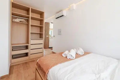 a bedroom with a bed with two towels at Sandora Pearl By Seareen, Penthouse with sea view in Albufeira