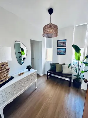 a living room with a couch and a mirror at Vilamoura Living 106 in Quarteira