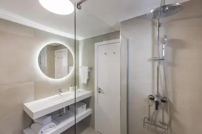 a bathroom with a sink and a shower at Albufeira Club 109 in Albufeira