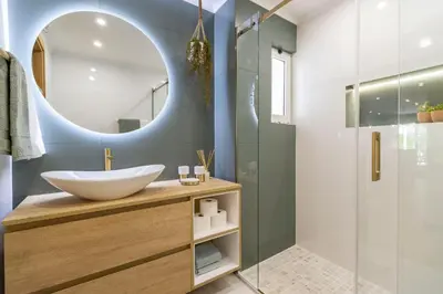 a bathroom with a sink and a mirror at Luxury Garden House Apartment - Golf & Tennis Court & Pools in Albufeira