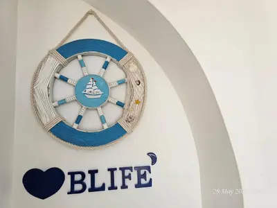 a close up of a sign on a surfboard at Blife Bandaya private rooms at Faro beach in Faro