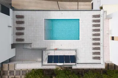 an aerial view of a building with a swimming pool at Terracos de Quarteira II Pearl by Real Properties in Quarteira