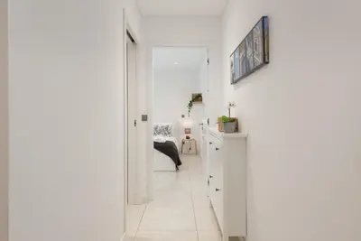 a hallway with white walls and a white floor at Terracos de Quarteira I Aqua by Real Properties in Quarteira