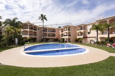 an image of a swimming pool in front of a building at Praia Village III - Peaceful condominium by HD in Quarteira
