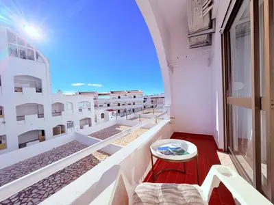 a balcony with a view of a building at Casita 9 in Albufeira