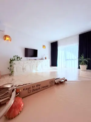 a living room with a table and a couch at Casita 9 in Albufeira