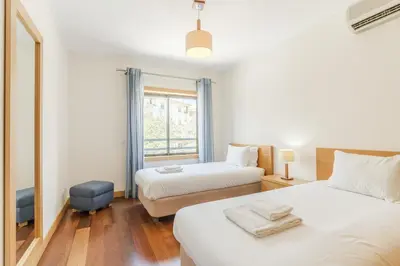 a kitchen with a table with a plate of fruit on it at #327 Corcovada 43 Vista Piscina by Home Holidays in Albufeira