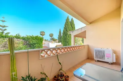 a swimming pool in a yard with chairs and an umbrella at Entre o Vale e o Mar - Vale Parra in Guia