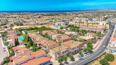 an aerial view of a village with roofs at Entre o Vale e o Mar - Vale Parra in Guia