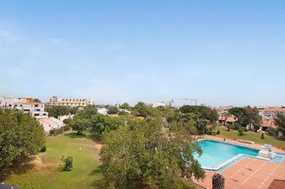 an overhead view of a swimming pool in a city at The Oura Stay in Albufeira
