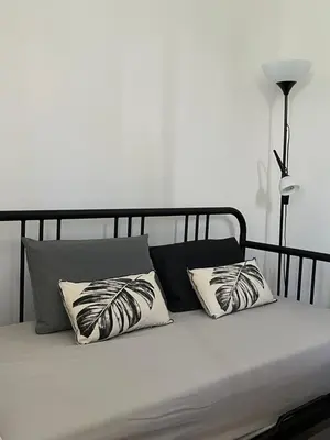a bed with two pillows on top of it at Pátio da Várzea in Albufeira