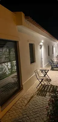 a couple of chairs sitting outside of a building at Pátio da Várzea in Albufeira